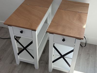 2 Farmhouse Style White and Wood Accent Tables with Storage Shelves with integrated electrical outlet.