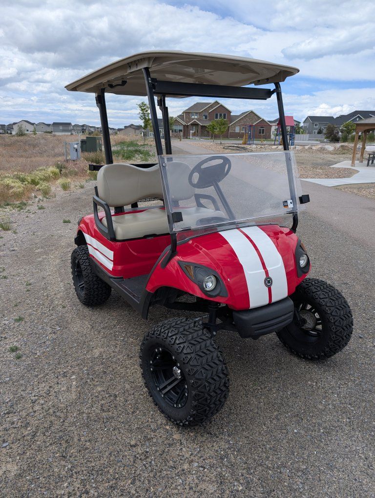 Yamaha Red Golf Cart with Lift Kit, All-Terrain Tires, and Speakers