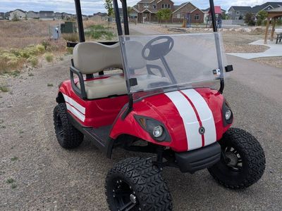 Yamaha Red Golf Cart with Lift Kit, All-Terrain Tires, and Speakers