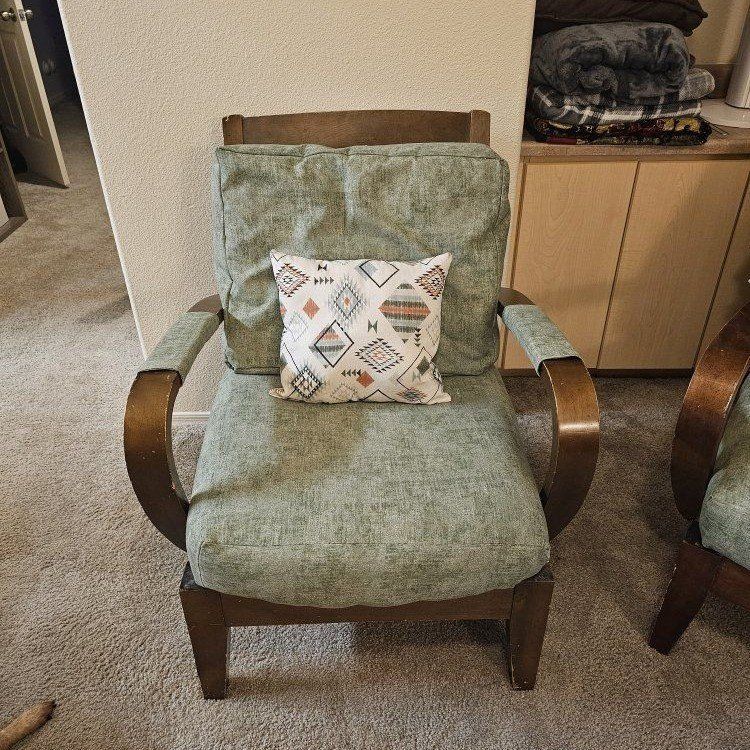 Vintage Mid-Century Green Upholstered Armchair with Wooden Frame and Geometric Pillow
