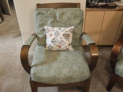 Vintage Mid-Century Green Upholstered Armchair with Wooden Frame and Geometric Pillow