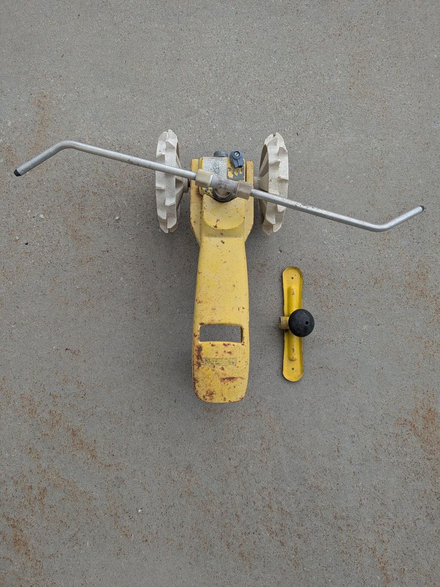 traveling sprinkler lawn tractor