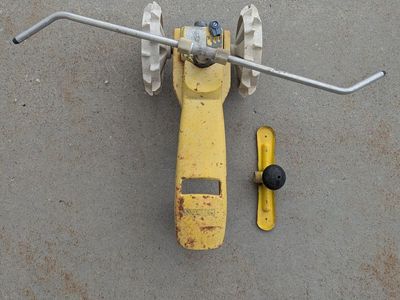traveling sprinkler lawn tractor