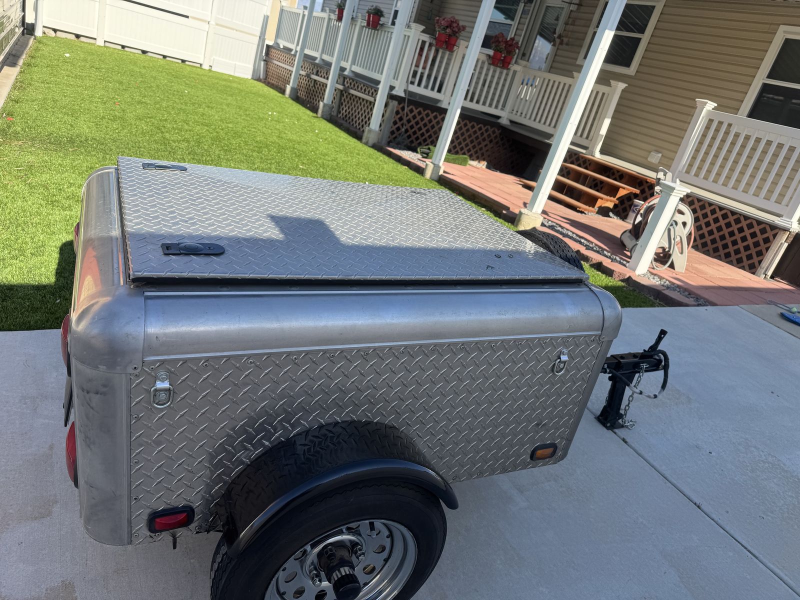 Cargo trailer can  be tow behind a car or motorcycle