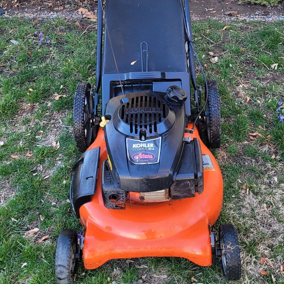 ariens pushing lawnmower