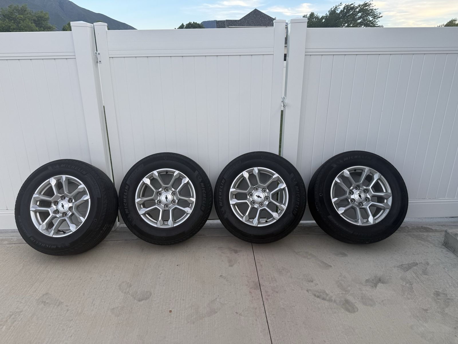Chevy 6 lug truck rims.  18 in silver stock rims