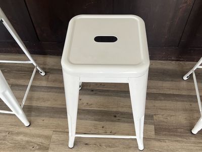 4 White metal bar stools