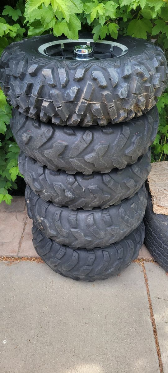 5-25" Polaris Rims w/ 4 used tires mounted, 1 new tire mounted
