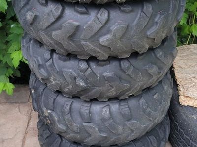 5-25" Polaris Rims w/ 4 used tires mounted, 1 new tire mounted