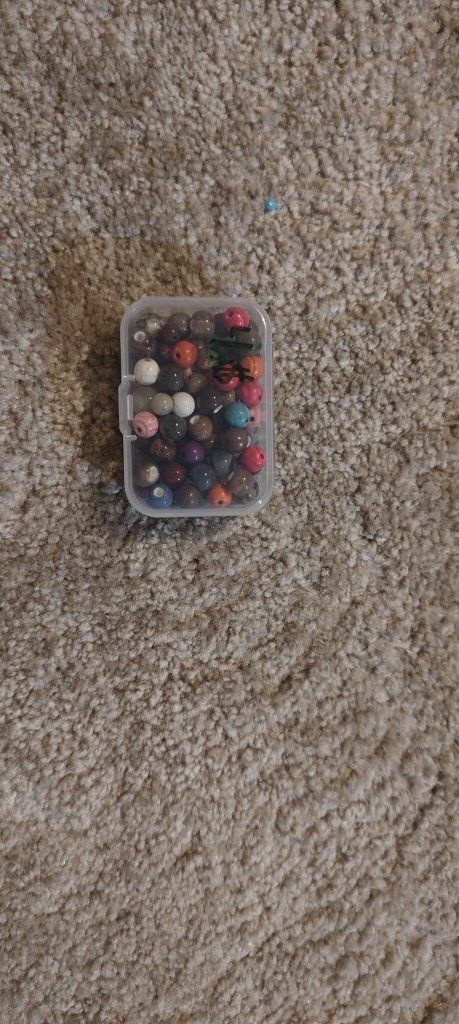 Assorted Colorful Beads in Small Plastic Storage Container