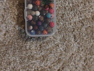 Assorted Colorful Beads in Small Plastic Storage Container