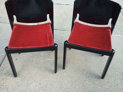 Pair of 122 Chairs by Vico Magistretti for Cassina in black laquer and red velvet