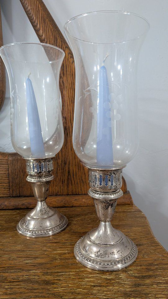 set of antique candle holders with silver base
