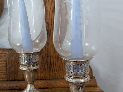 set of antique candle holders with silver base