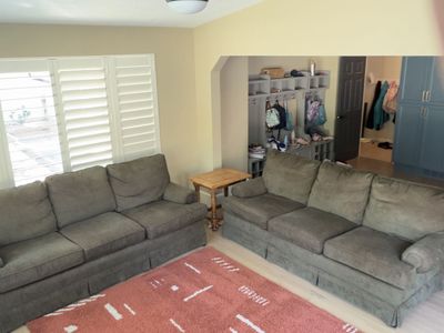 Pair of Comfortable Three-Seater Couches - Good Condition