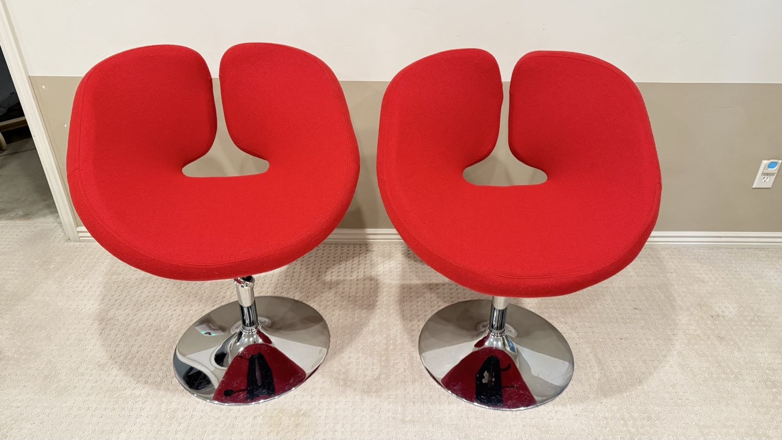 Red upholstered swivel chair
