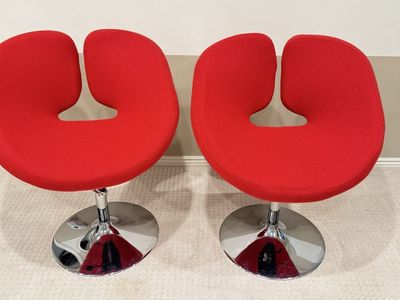Red upholstered swivel chair