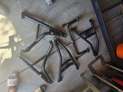 Polaris Xpedition Northstar front control arms and sway bar.