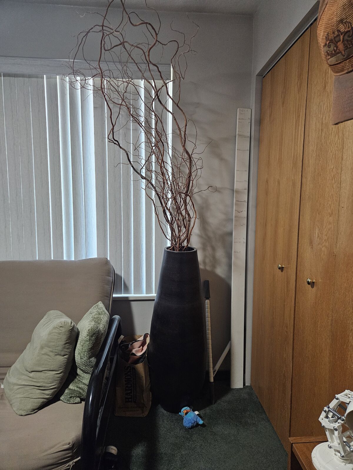 Tall vase with decorative sticks