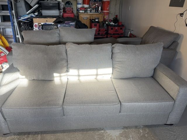 Grey fabric couch, love seat, chair and ottoman set
