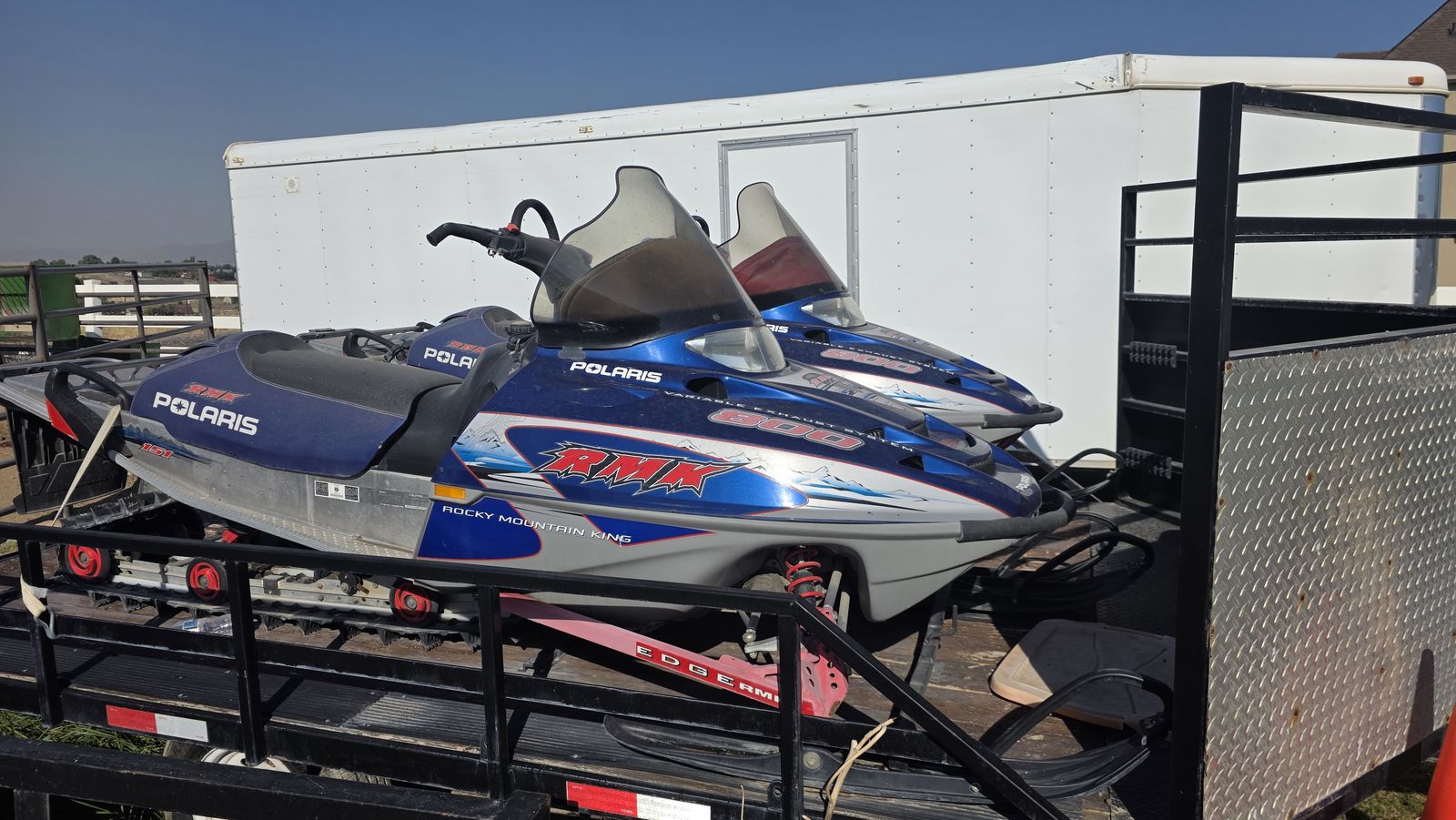 Pair of Polaris RMK 800 Rocky Mountain King Snowmobiles