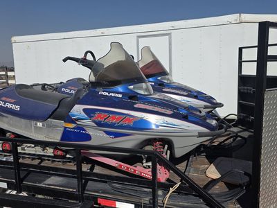 Pair of Polaris RMK 800 Rocky Mountain King Snowmobiles