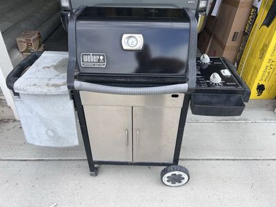 Weber Genesis Silver Liquid Propane Gas Grill with Side Shelf and Storage Cabinet