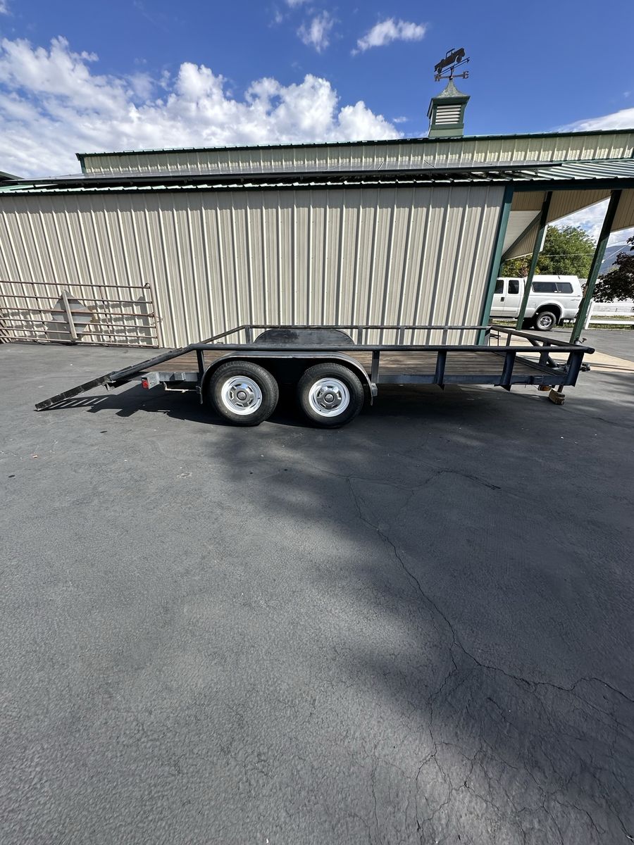 Dual Axle Utility Trailer with Wooden Deck and Ramps