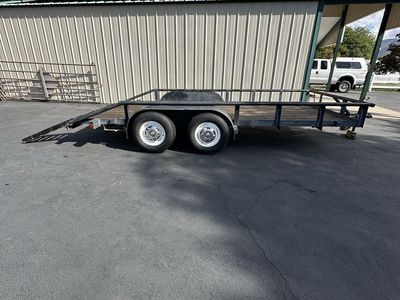 Dual Axle Utility Trailer with Wooden Deck and Ramps