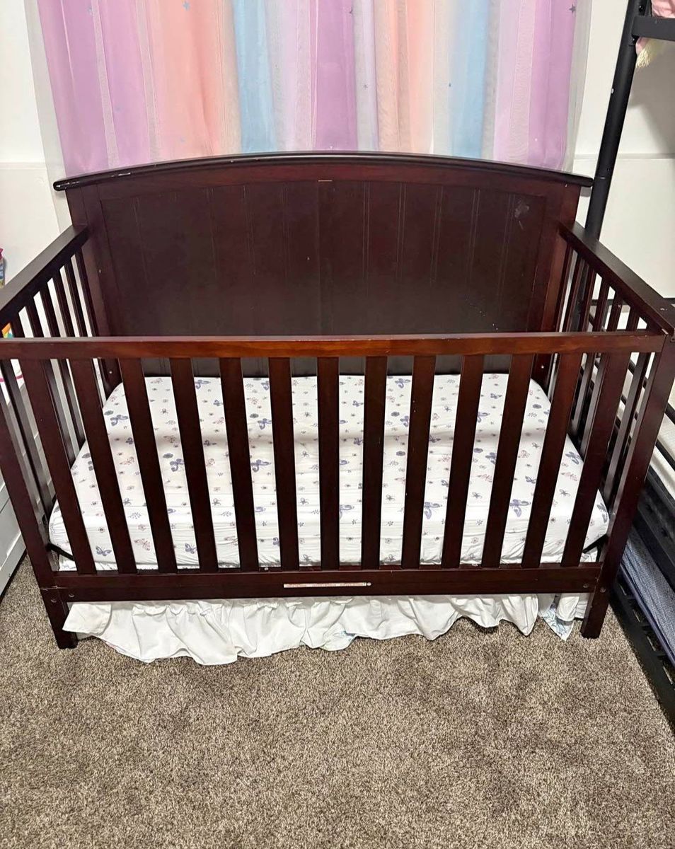 Crib and mattress - dark wood