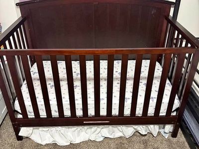 Crib and mattress - dark wood