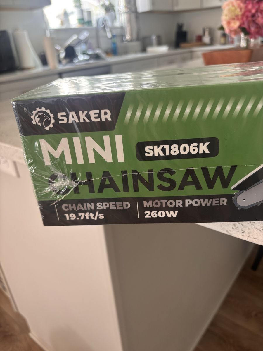 Mini chainsaw new never opened