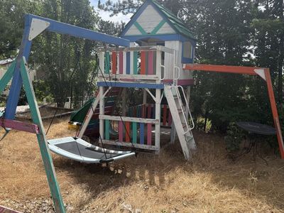 Kid's Outdoor Playhouse with Slide - Sturdy Wooden Construction, Weathered Paint