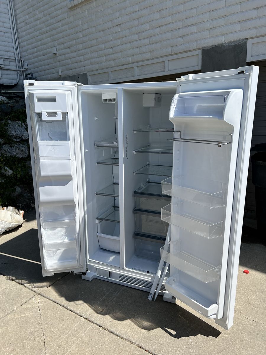 FREE. Whirlpool White Side-by-Side Refrigerator with Ice Maker & Water Dispenser