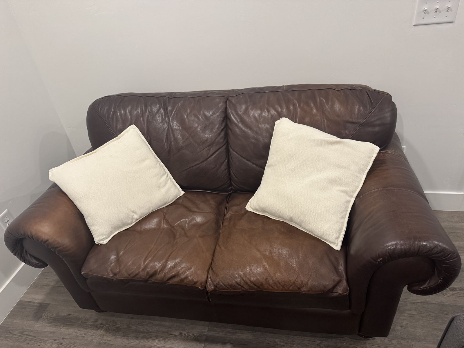 Brown Leather Loveseat – Rolled Arms, Bun Feet | Used