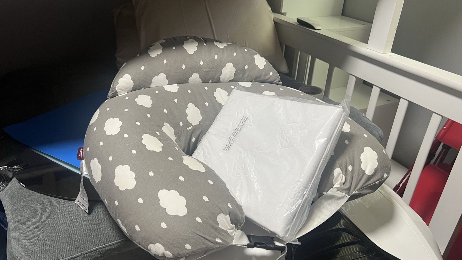 Boppy Original Nursing Pillow , Gray with White Clouds, and a new crib mattress protector