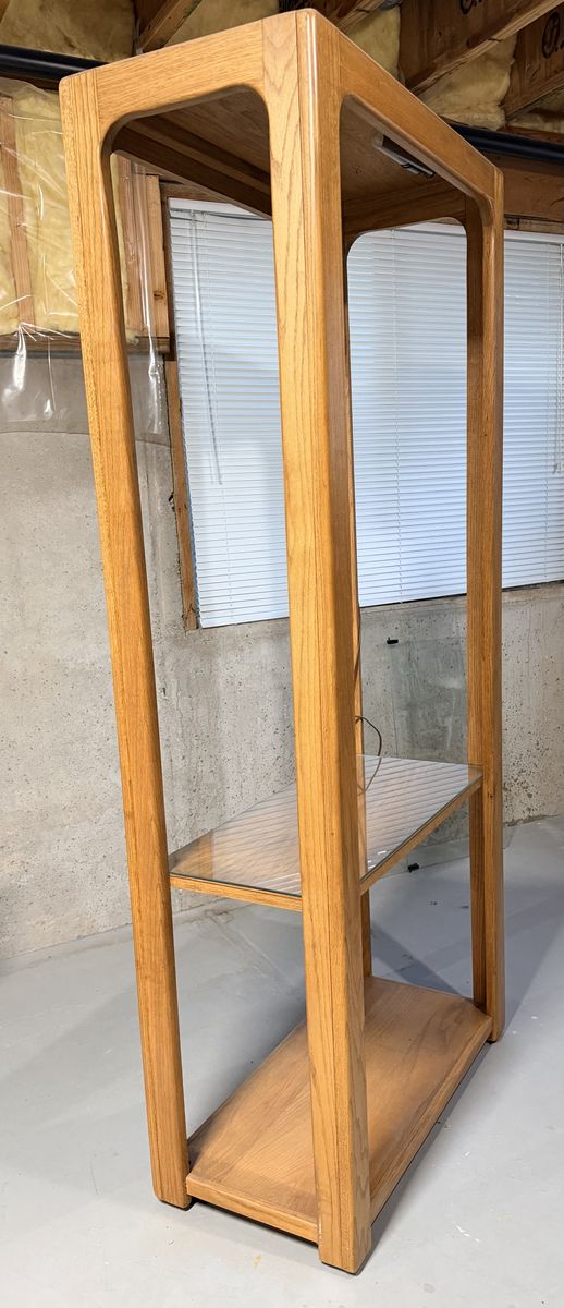 This is a Vintage Mid-Century Modern Solid Oak Lighted Display étagère