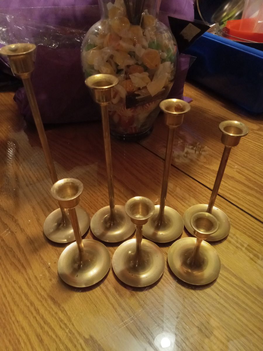 Vintage brass seven (7) candle holder set. These candle holders are actually brass finish of stainless steel.