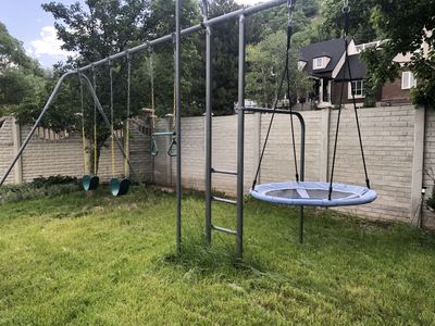 Heavy-duty swing set and play tower with slide (disassembled and ready for pickup)