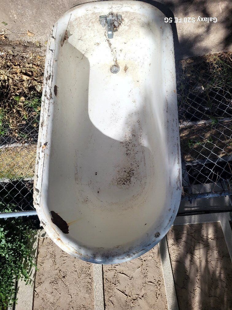 big heavy old cast iron bathtub