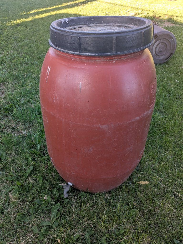 Red Rain Barrel with Spigot and Lid for Garden Water Collection