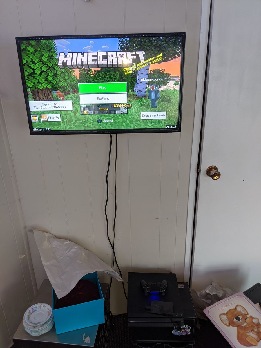 PS 4 with controller and tv
