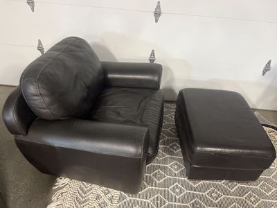 2 identical Black leather chairs and ottomans