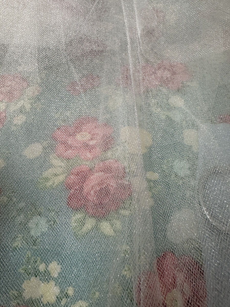 96 x 52" Oval of fine netting for a wedding veil.