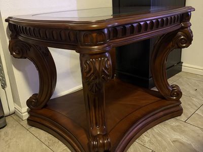 Ornate Wooden End Table with Inset Glass Top and Carved Details