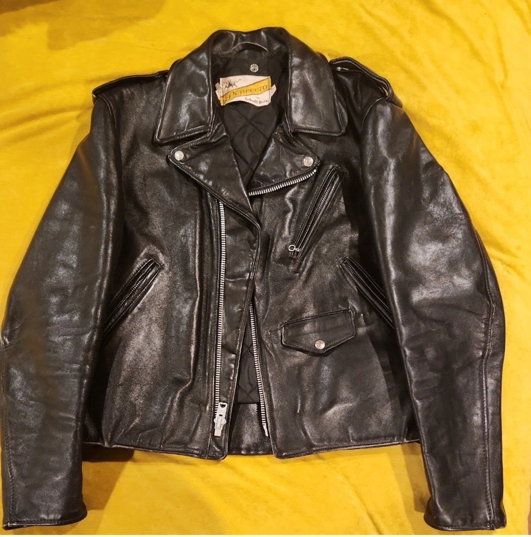 vintage Schott Perfecto size 44 Black leather double lined motorcycle jacket
lace-up sides, zippered cuffs