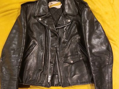vintage Schott Perfecto size 44 Black leather double lined motorcycle jacket
lace-up sides, zippered cuffs