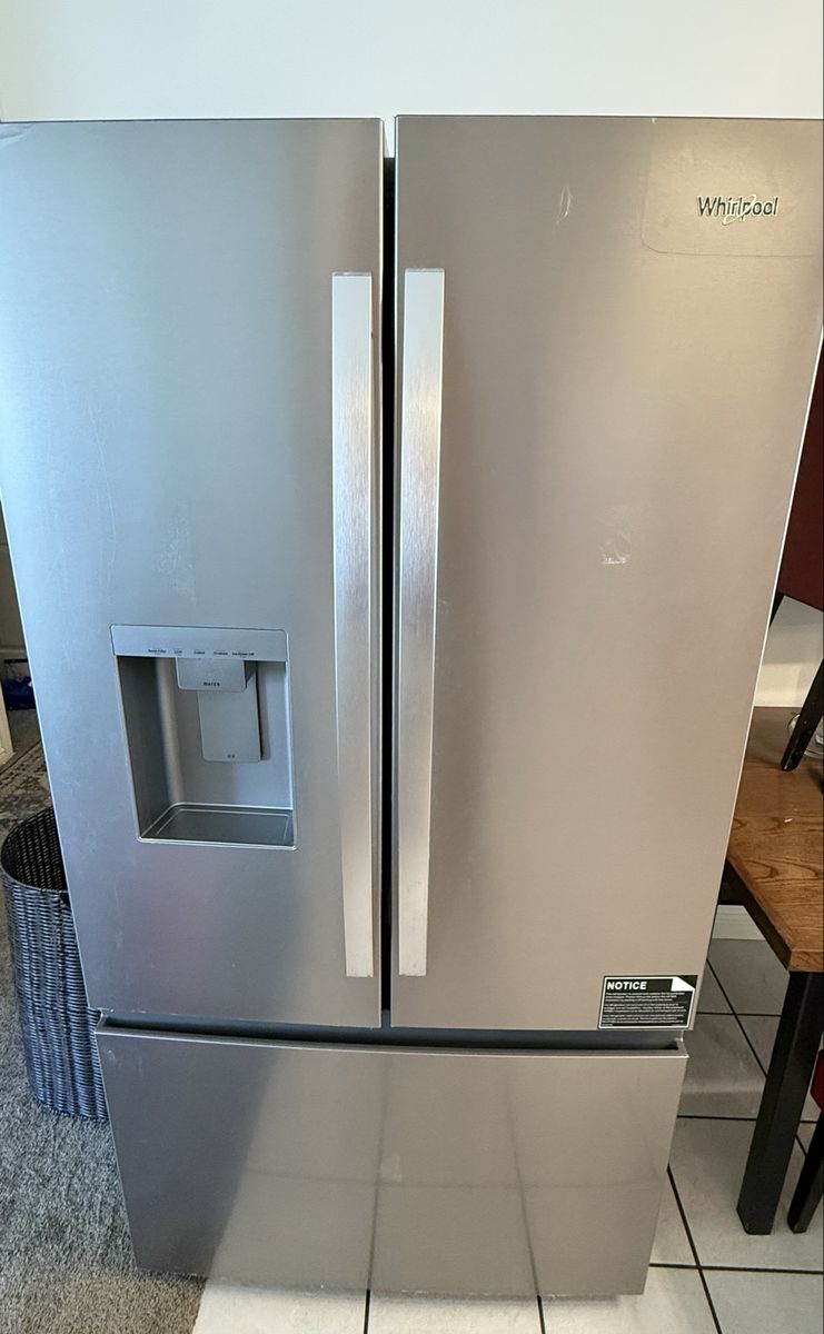 Whirlpool Stainless Steel French Door Refrigerator with Ice & Water Dispenser still under factory warranty.