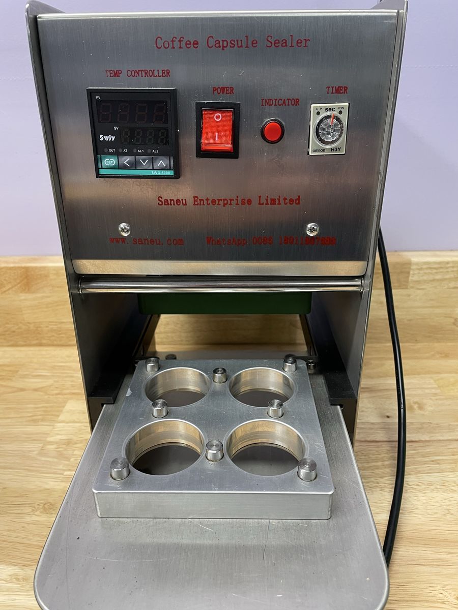Coffee pod sealing machine