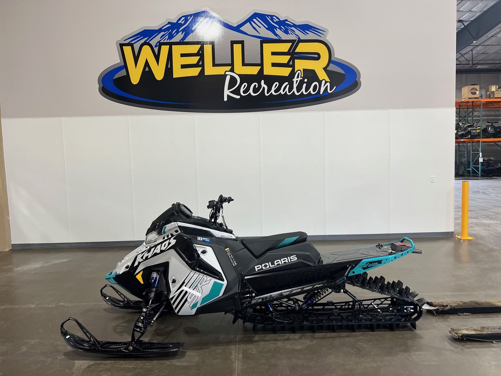 2025 Polaris 9R RMK KHAOS 155       WHITE/BLACK/GREEN